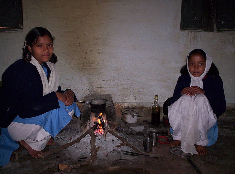 Indian Girls Making Tea Over an Open Fire