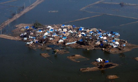 Climate change could cause extreme weather leaving millions of people trapped, a new report claims. Photograph: Rizwan Tabassum/AFP/Getty Images Climate change could cause extreme weather leaving millions of people trapped, a