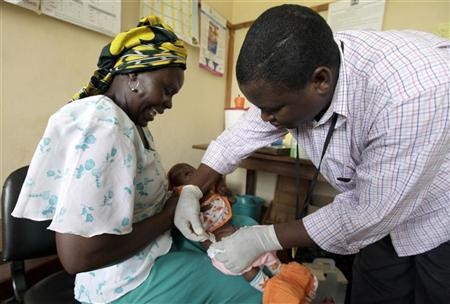Iren Salama (L) holds her baby Pendo as it is given an injection as part of a malaria vaccine trial at a clinic in the Kenya coastal town of Kilifi, November 23, 2010. Credit: Reuters/Joseph Okanga Iren Salama (L) holds her baby Pendo as it is given an injection as part of a ma